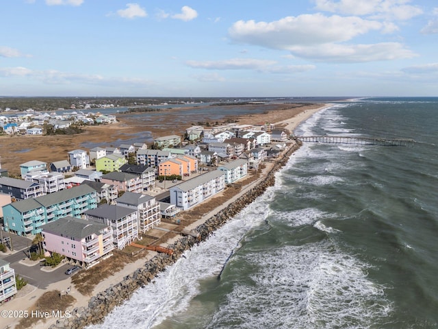 aerial view featuring a view of the beach and a water view