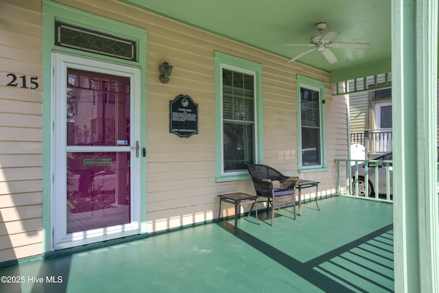 exterior space with ceiling fan and a porch