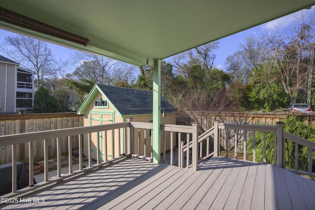 wooden terrace with a shed