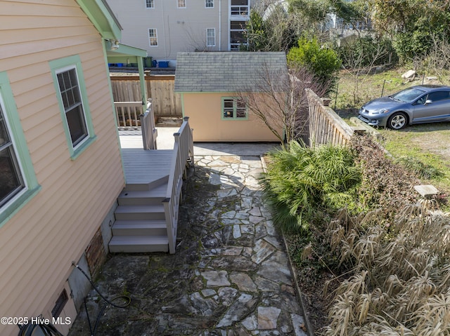 view of patio featuring a storage unit