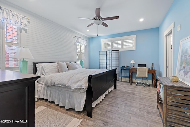 bedroom featuring light hardwood / wood-style flooring and ceiling fan