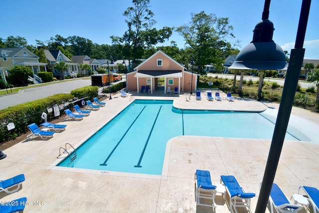 view of swimming pool with a patio area