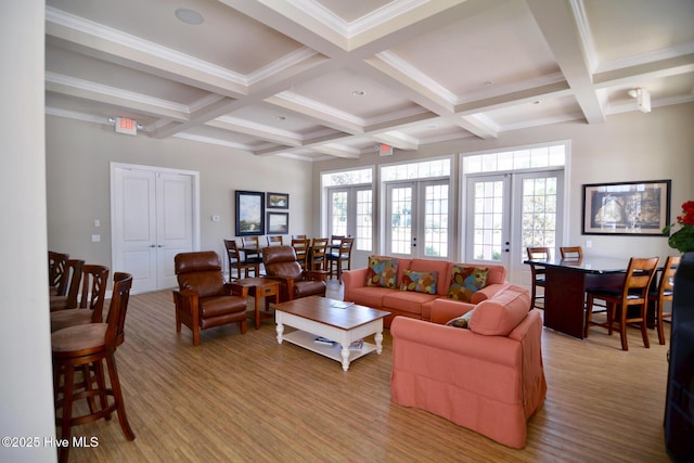 living room featuring beamed ceiling, coffered ceiling, and french doors