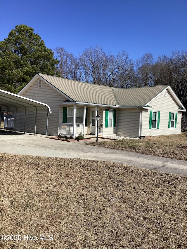 single story home with a carport and covered porch