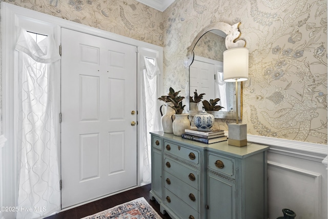 entryway with wallpapered walls and dark wood-style flooring
