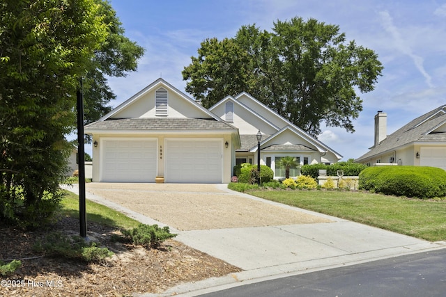 view of front of home featuring an attached garage, concrete driveway, a front yard, and stucco siding