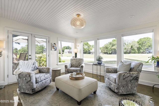 sunroom featuring healthy amount of natural light and french doors