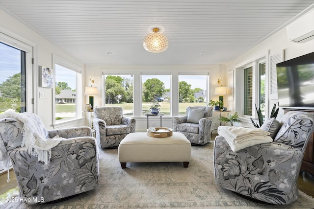 sunroom / solarium featuring a wall mounted air conditioner