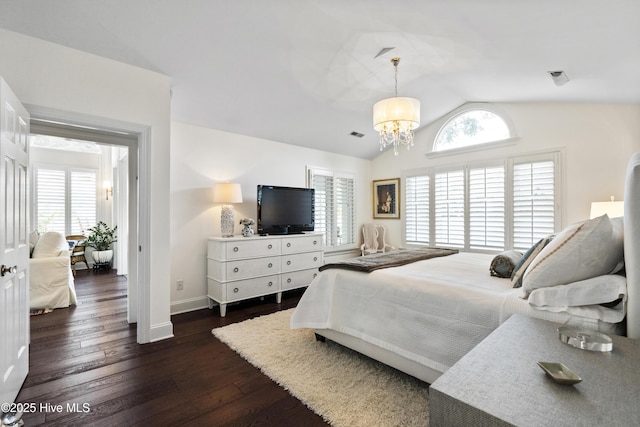 bedroom with lofted ceiling, multiple windows, dark wood-style floors, baseboards, and a chandelier
