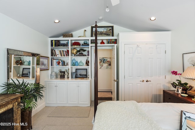 bedroom featuring lofted ceiling, light carpet, a closet, and recessed lighting