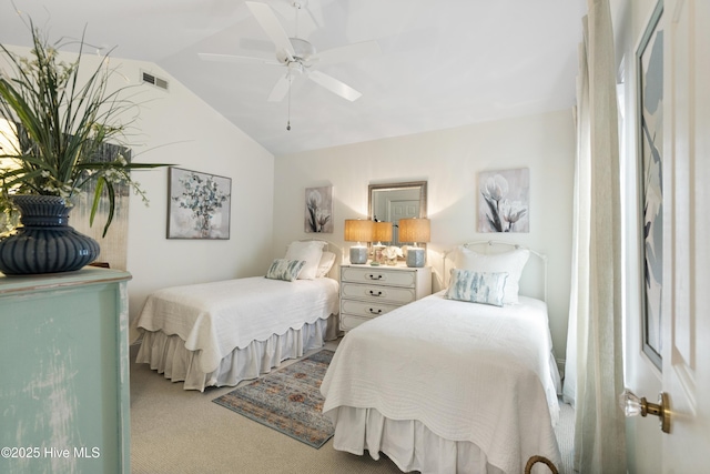 carpeted bedroom featuring vaulted ceiling and ceiling fan