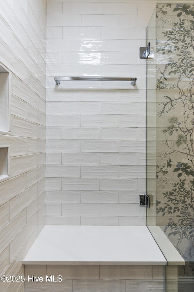 bathroom with a shower stall