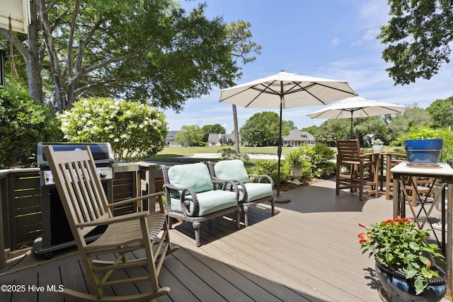 wooden deck with outdoor dining area