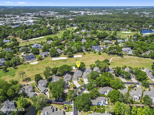 aerial overview of property's location featuring a local golf course and nearby suburban area