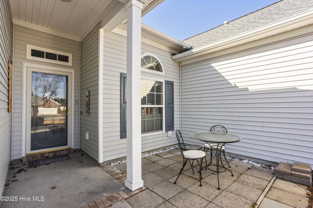 entrance to property featuring a patio