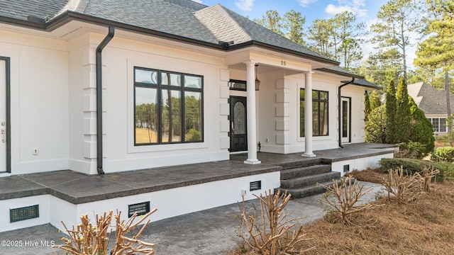 entrance to property featuring covered porch