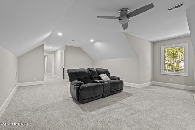 carpeted home theater room featuring ceiling fan and lofted ceiling