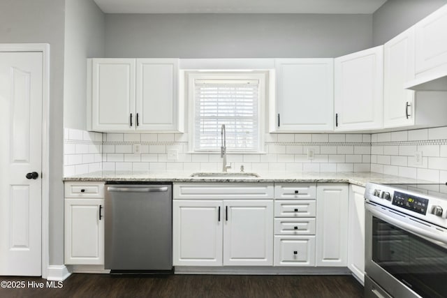 kitchen with stainless steel appliances, white cabinetry, and sink