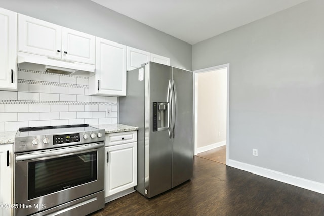 kitchen featuring light stone countertops, appliances with stainless steel finishes, and white cabinets