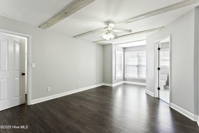 spare room with beamed ceiling, dark hardwood / wood-style floors, and ceiling fan