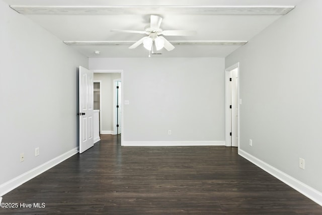 empty room featuring ceiling fan and dark hardwood / wood-style flooring