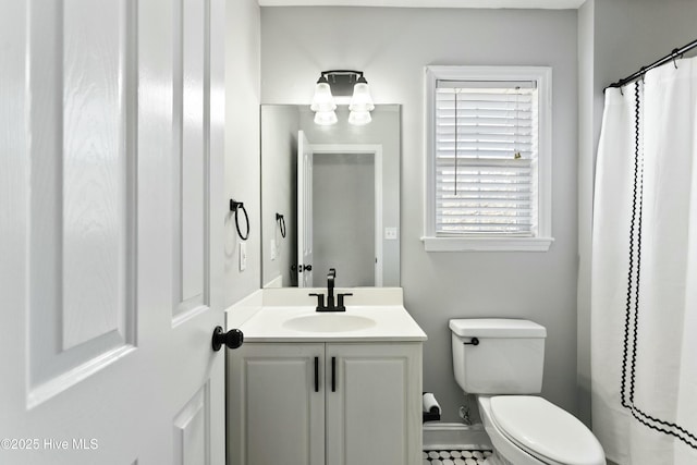 bathroom with vanity and toilet