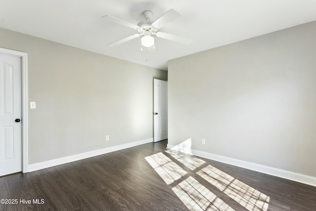 empty room featuring dark hardwood / wood-style floors and ceiling fan