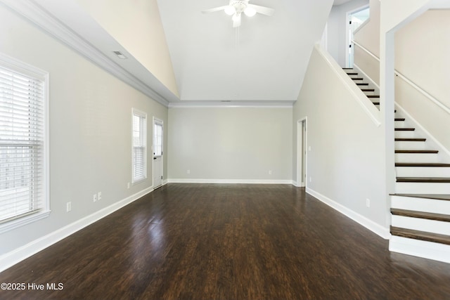 unfurnished living room with ceiling fan, dark hardwood / wood-style floors, and high vaulted ceiling