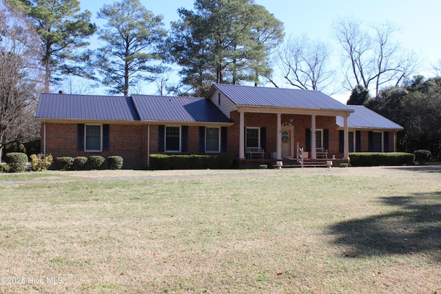 single story home with a porch and a front yard