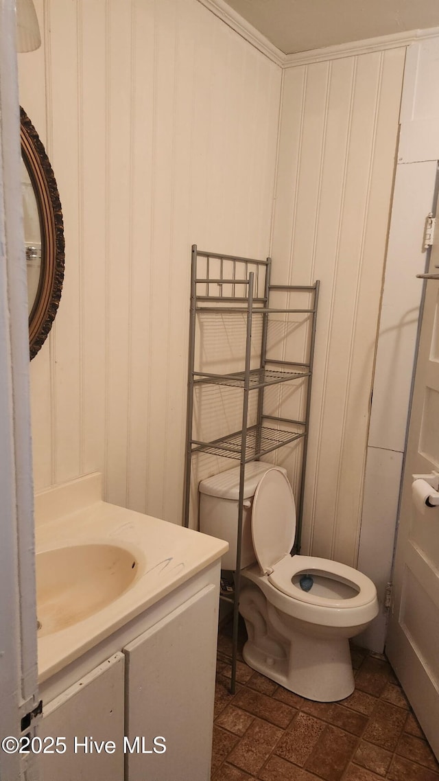 half bath with vanity and toilet