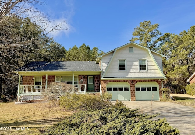 split level home with a garage and covered porch