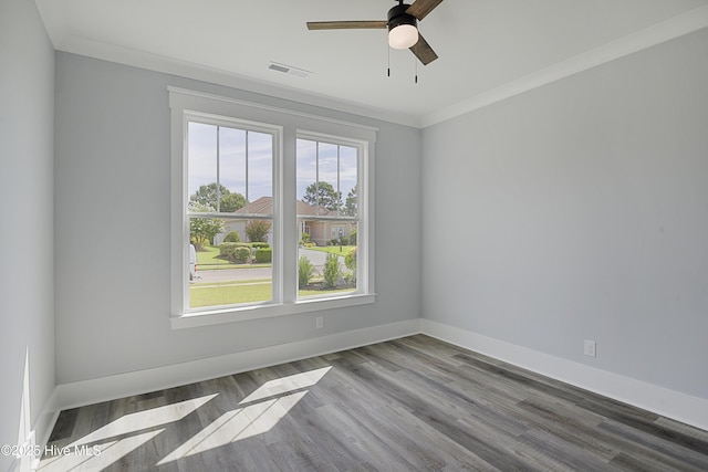 empty room with crown molding, ceiling fan, and light wood-type flooring