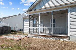 rear view of house with a sunroom