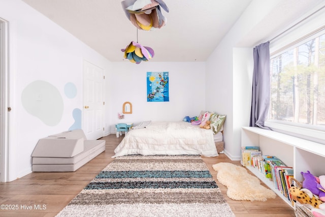 bedroom featuring light wood-type flooring