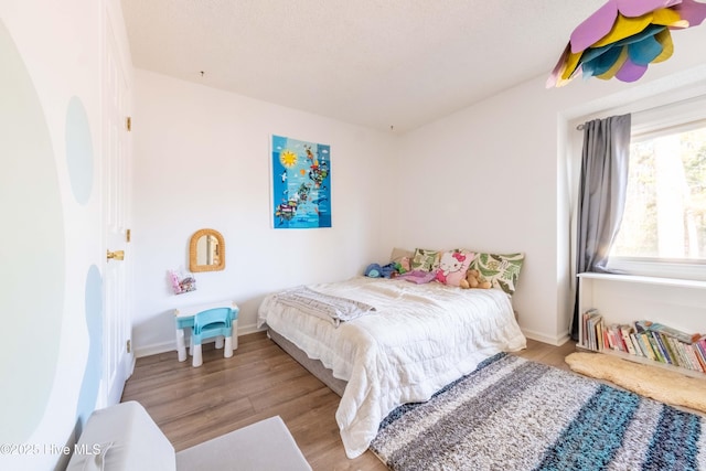 bedroom featuring light hardwood / wood-style floors