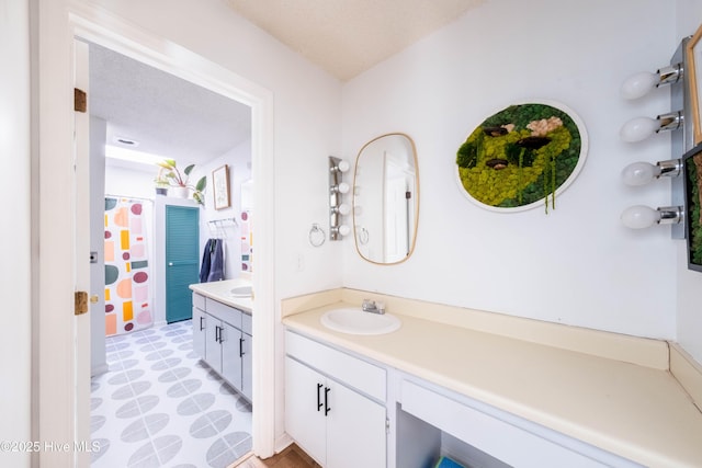 bathroom featuring vanity and walk in shower