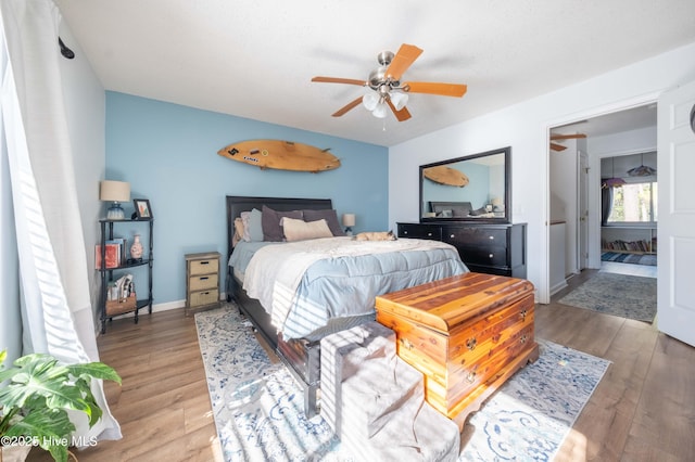 bedroom featuring ceiling fan and light wood-type flooring