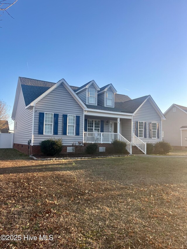 view of front of home featuring a front yard and covered porch