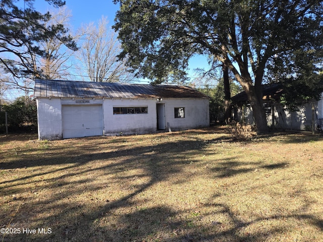 garage with a lawn