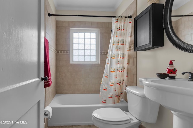 full bathroom with toilet, ornamental molding, sink, and shower / bath combo with shower curtain