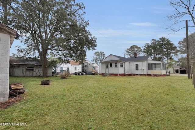 view of yard with a sunroom