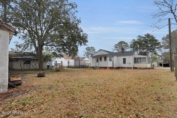 view of yard featuring a sunroom