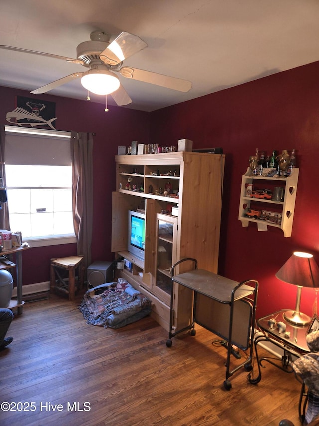 interior space with hardwood / wood-style flooring and ceiling fan