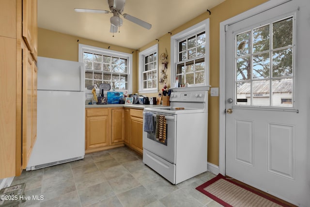 kitchen with plenty of natural light, light brown cabinets, and white appliances