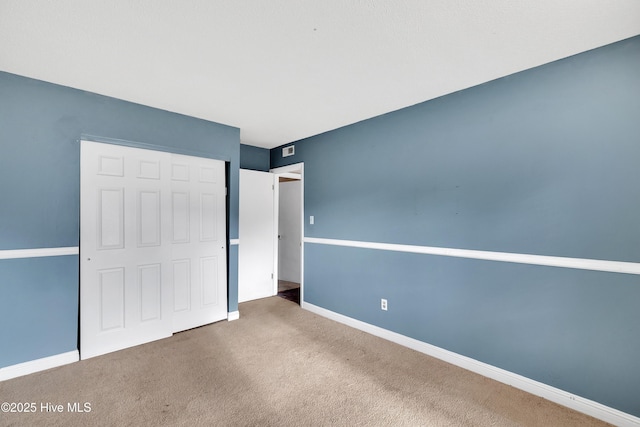 unfurnished bedroom featuring carpet flooring