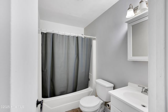 full bathroom with vanity, toilet, and shower / bath combo with shower curtain