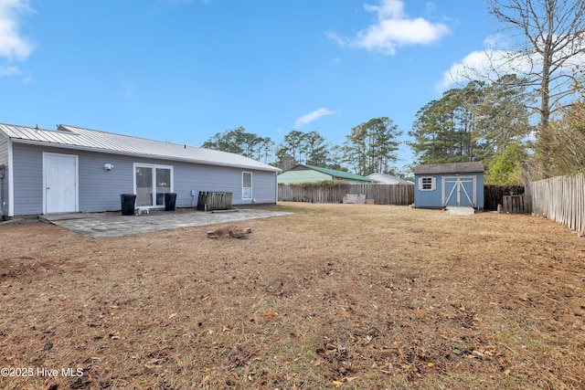 view of yard with a patio area and a shed