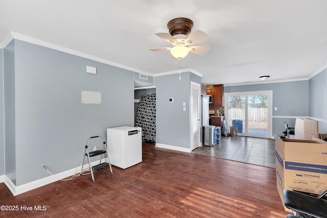 office space with dark wood-type flooring, ornamental molding, and ceiling fan