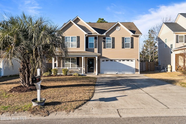 view of front property featuring central AC, covered porch, and a garage