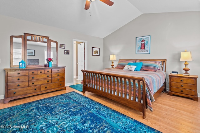 bedroom featuring lofted ceiling, hardwood / wood-style floors, and ceiling fan